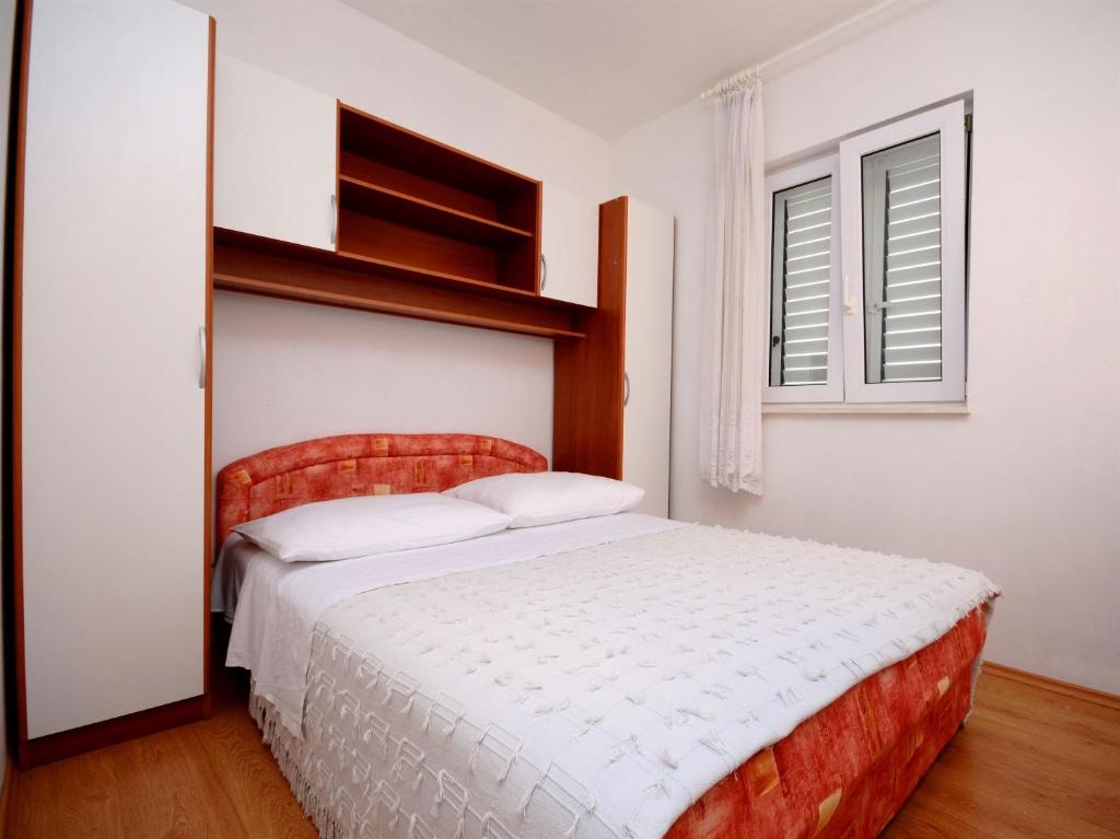 Postel nebo postele na pokoji v ubytování Apartments Marijo