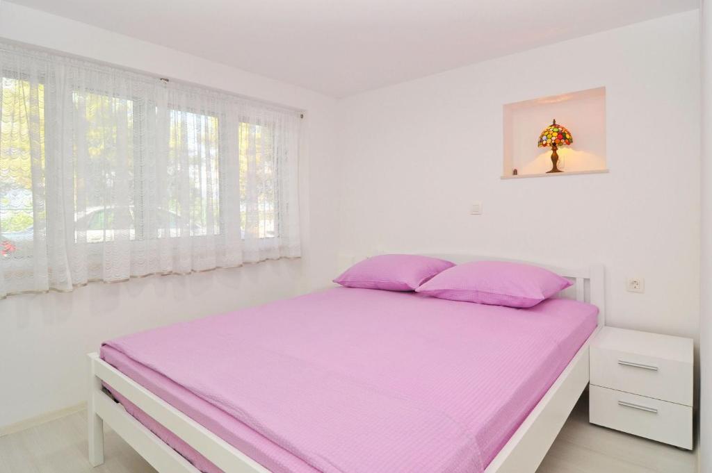 Postel nebo postele na pokoji v ubytování Apartment Steli