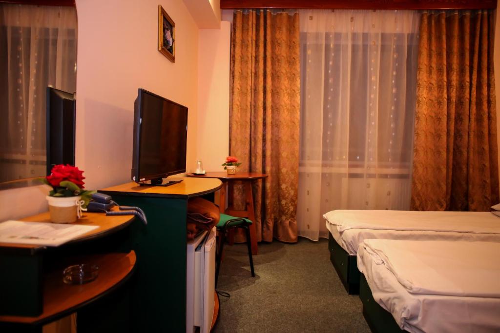 Postel nebo postele na pokoji v ubytování Hotel Silva