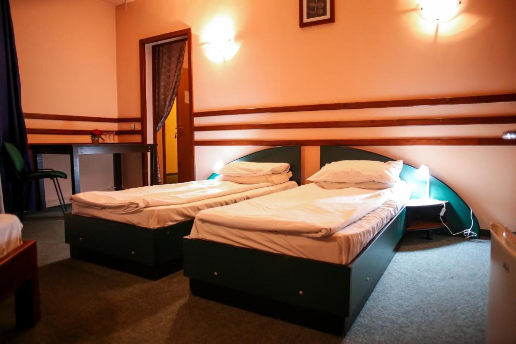 Postel nebo postele na pokoji v ubytování Hotel Silva