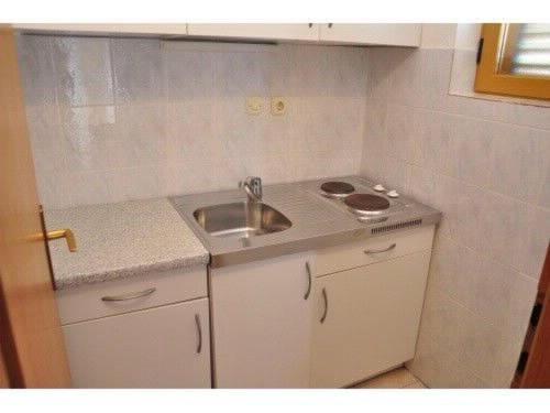 Kuchyňa alebo kuchynka v ubytovaní Apartments Meridiana 2
