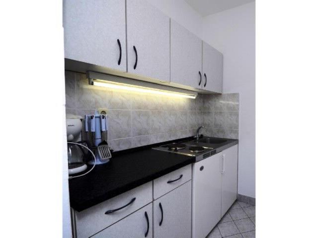 Kuchyňa alebo kuchynka v ubytovaní Apartments Meridiana 2