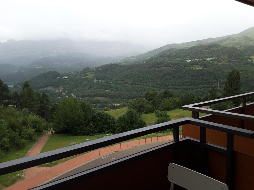 a balcony with a view of a mountain at Apartamentos Argualas in Panticosa