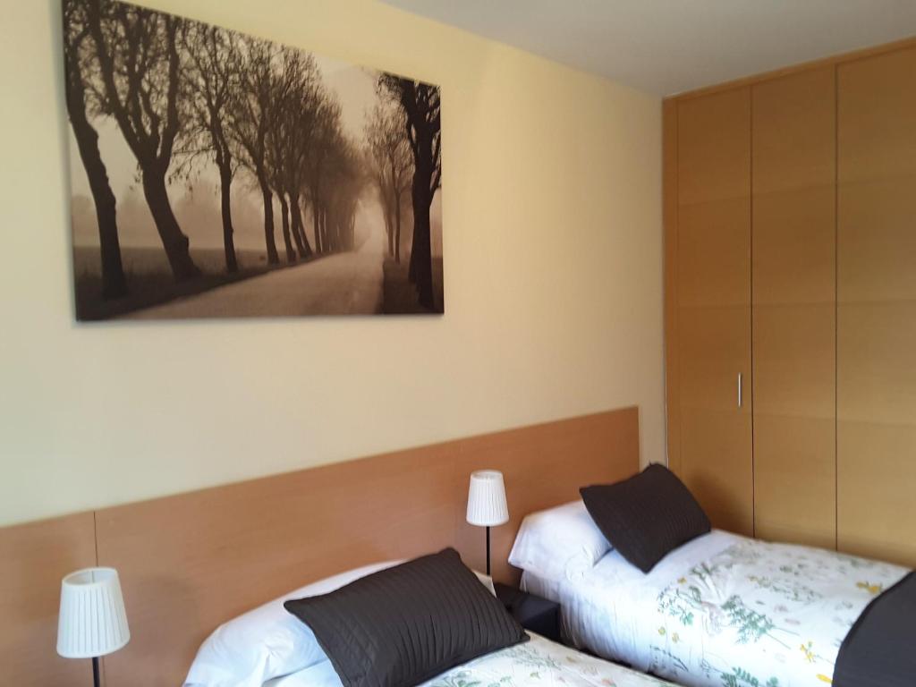 Postel nebo postele na pokoji v ubytování Apartamentos Argualas