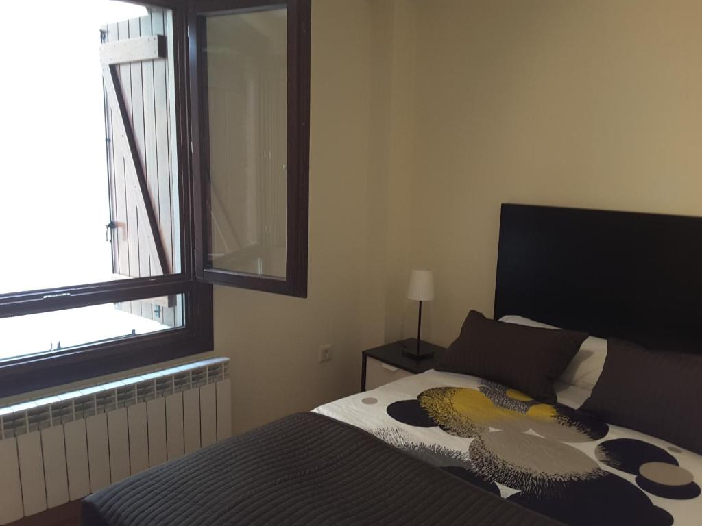 Postel nebo postele na pokoji v ubytování Apartamentos Argualas