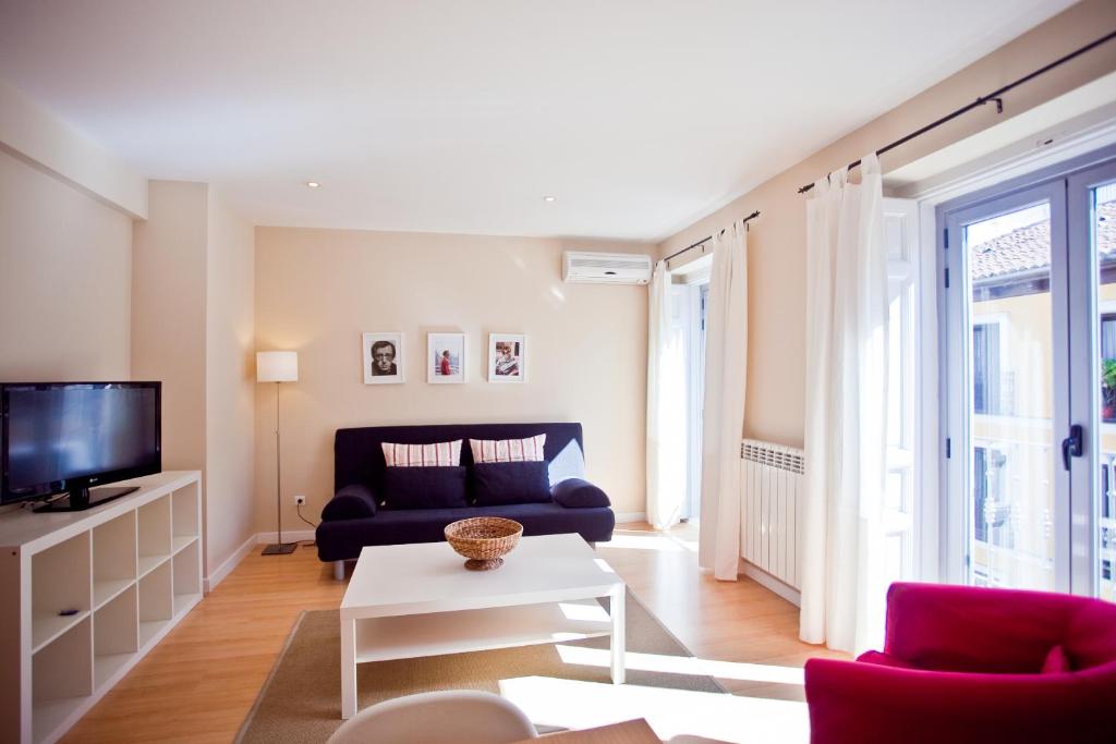 a living room with a couch and a tv at Apartment in the Centre in Madrid