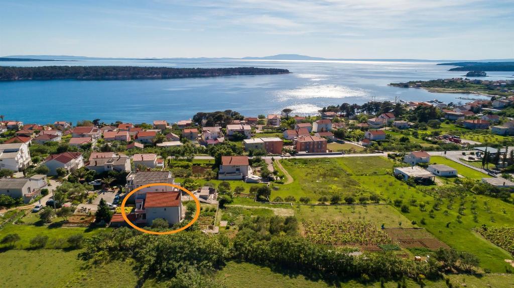 an aerial view of a house with an orange circle at Apartment Milja in Banjol