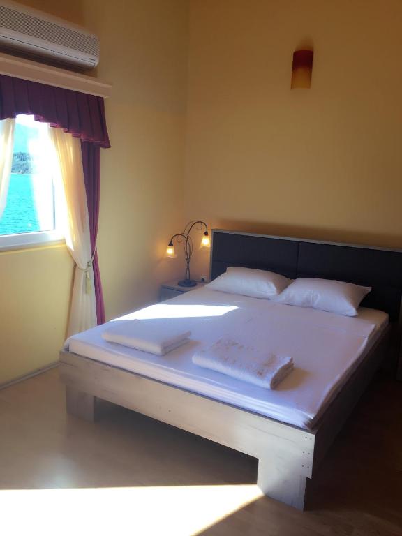 Postel nebo postele na pokoji v ubytování Apart hotel Samardzic