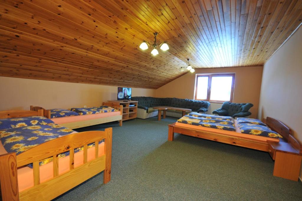 Postel nebo postele na pokoji v ubytování Penzion Jendrál