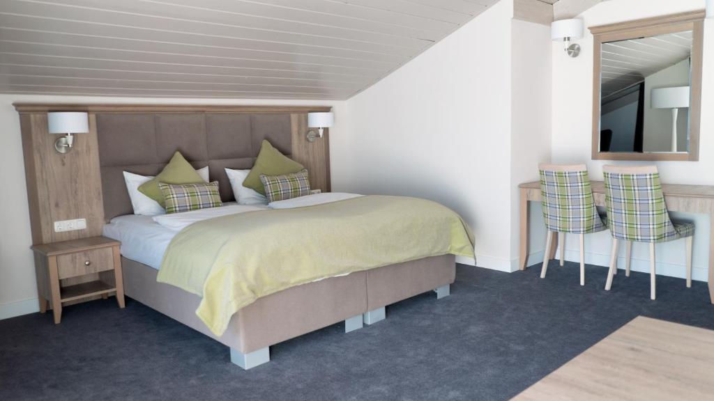 Postel nebo postele na pokoji v ubytování Hotel Quellenhof