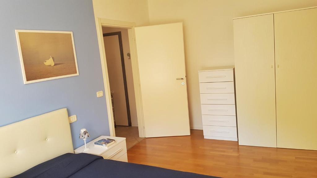 Łóżko lub łóżka w pokoju w obiekcie Appartamento Angi - lago & vacanza attiva