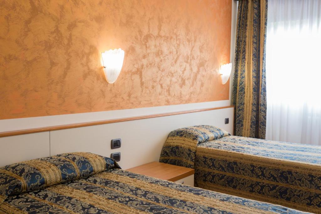 Postel nebo postele na pokoji v ubytování Hotel Airmotel