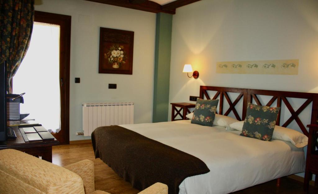 Postel nebo postele na pokoji v ubytování Hotel Casa Arcas