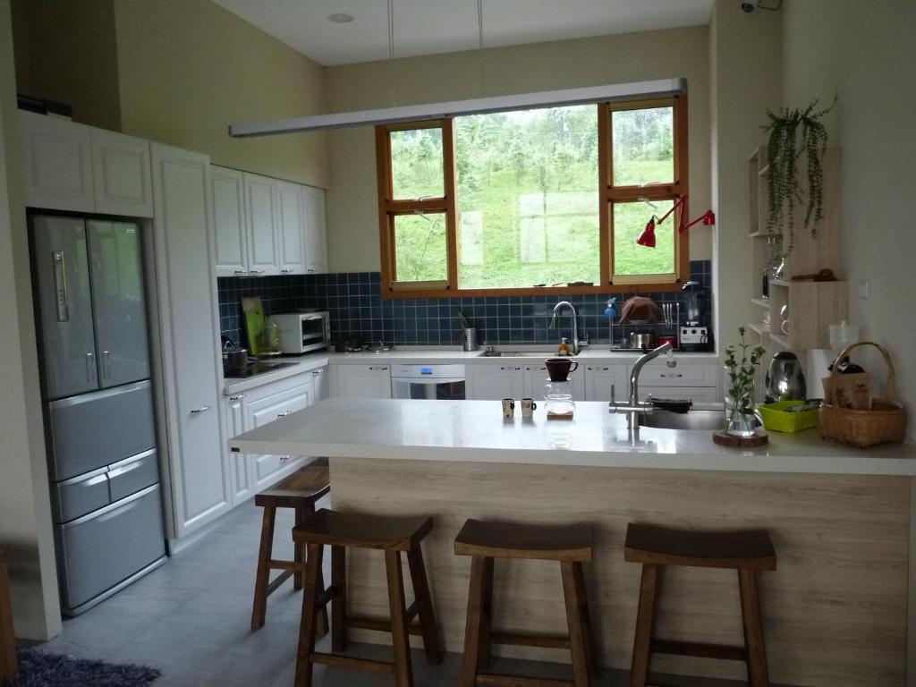 Kuchyň nebo kuchyňský kout v ubytování Xi Tou in Sunny Day Inn