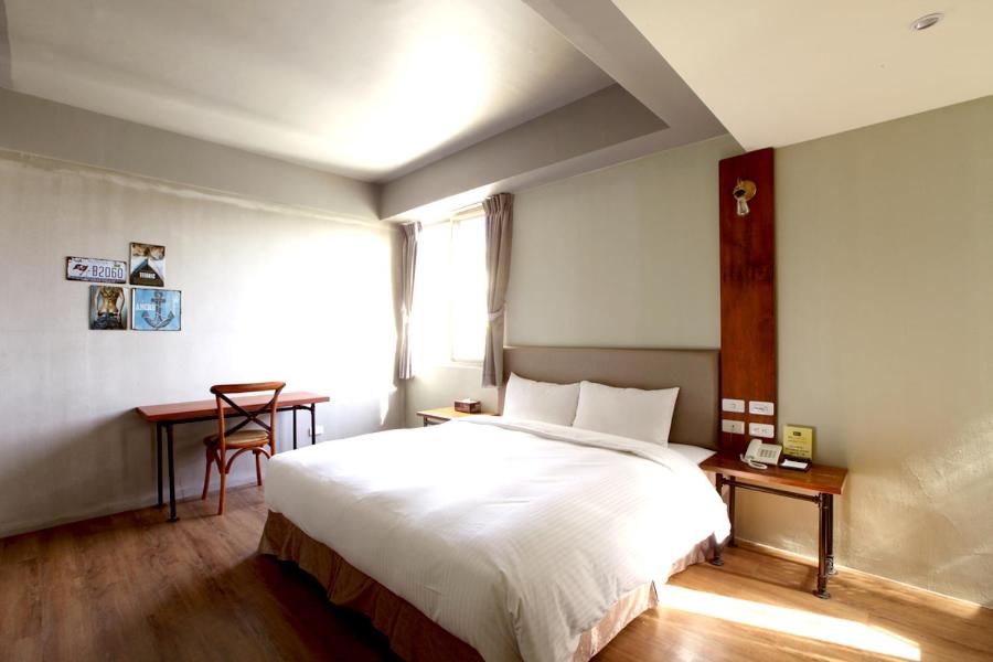 Postel nebo postele na pokoji v ubytování Tourism Inn
