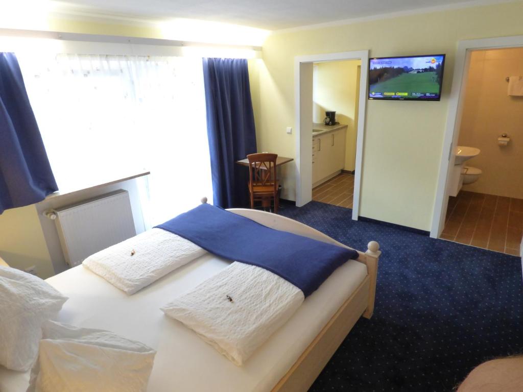 Postel nebo postele na pokoji v ubytování Panoramahotel