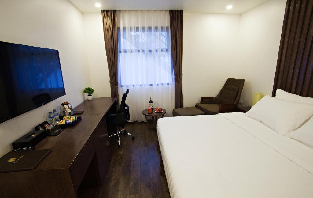 TV a/nebo společenská místnost v ubytování Inearth Hotel