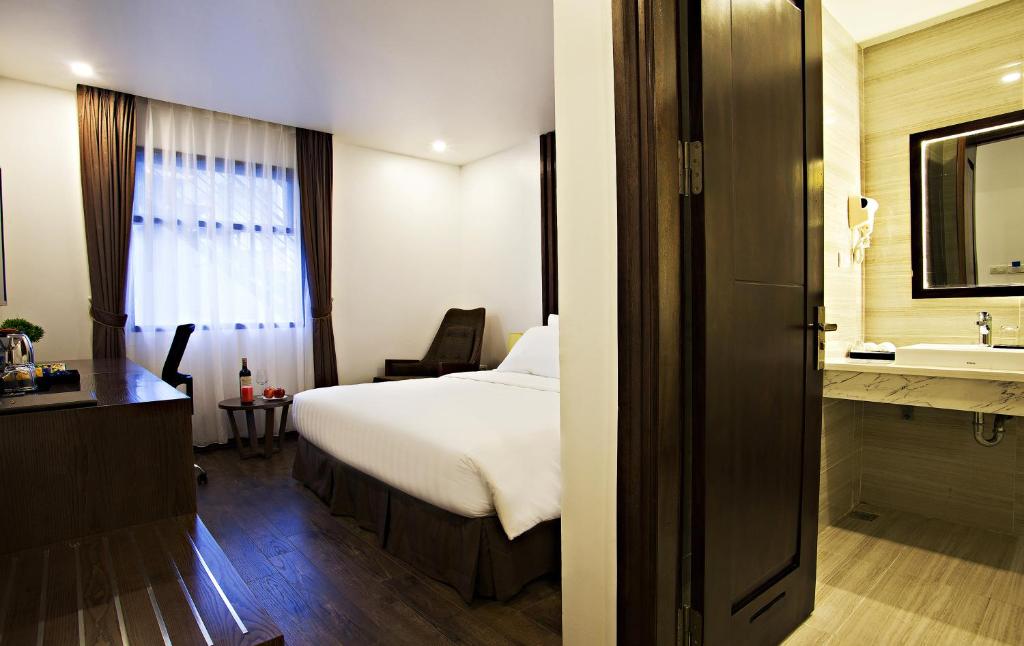Postel nebo postele na pokoji v ubytování Inearth Hotel