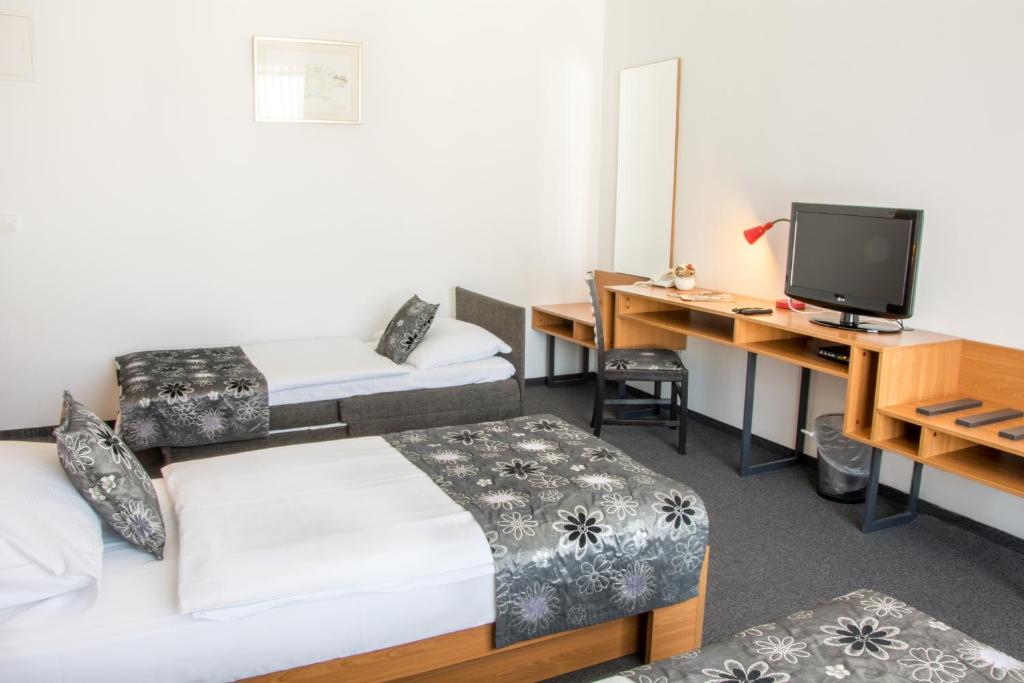 Postel nebo postele na pokoji v ubytování Hotel Delminivm