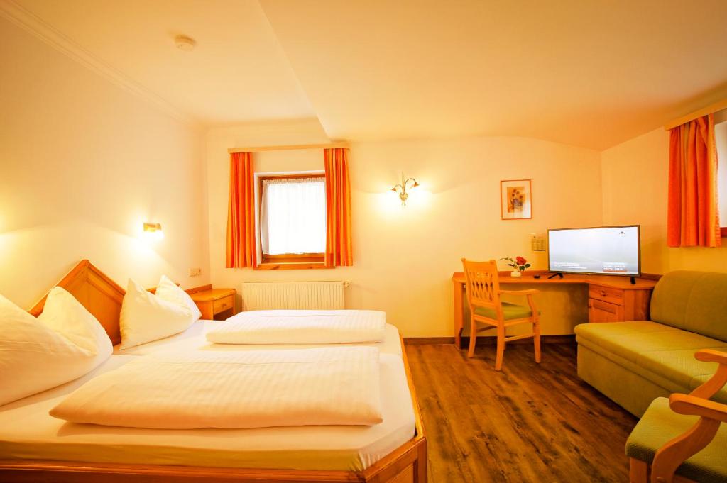 Postel nebo postele na pokoji v ubytování Haus Hubertus