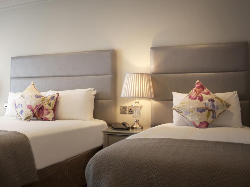 Postel nebo postele na pokoji v ubytování HYDE Hotel