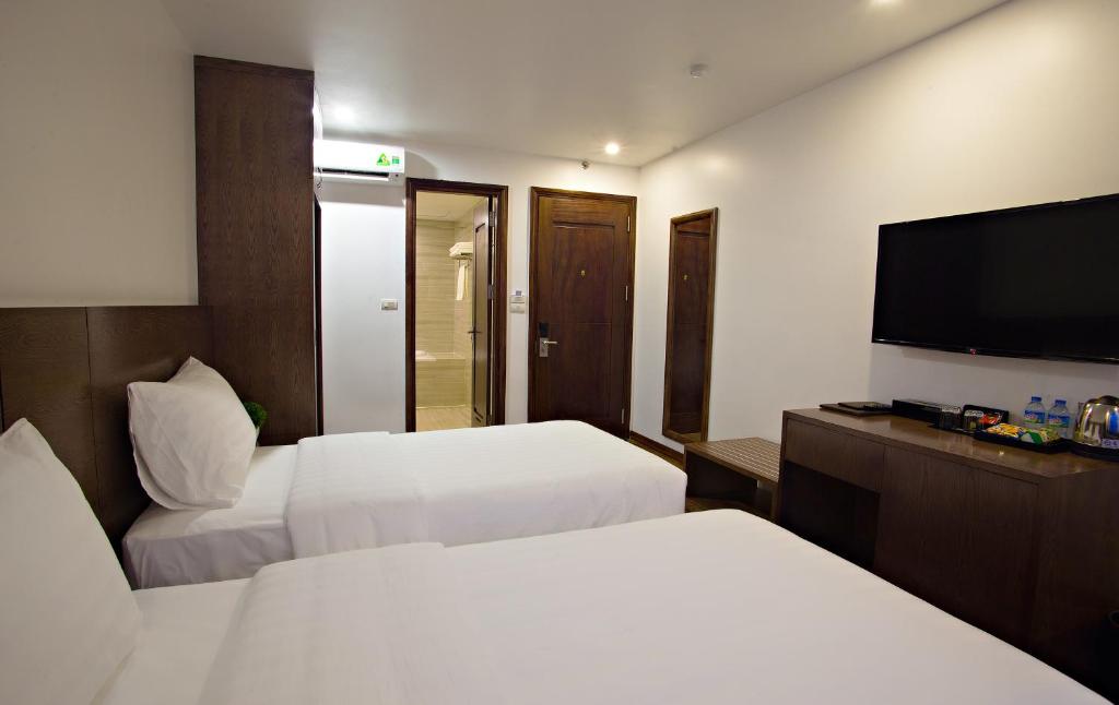 Postel nebo postele na pokoji v ubytování Inearth Hotel