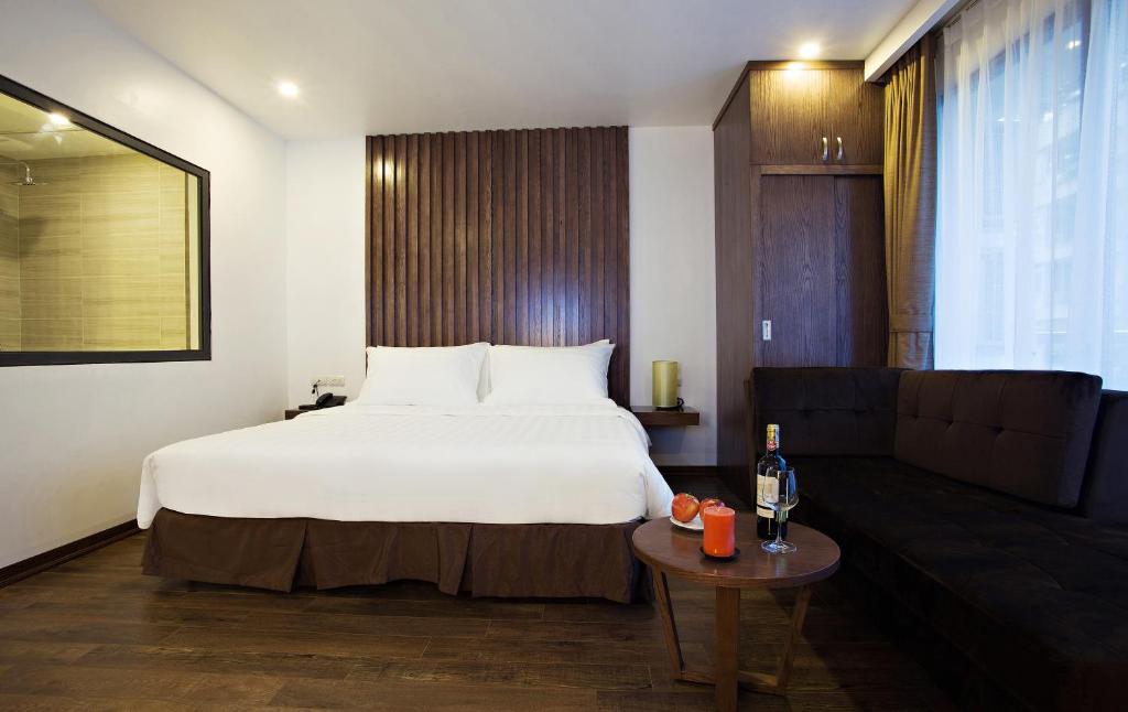 Postel nebo postele na pokoji v ubytování Inearth Hotel