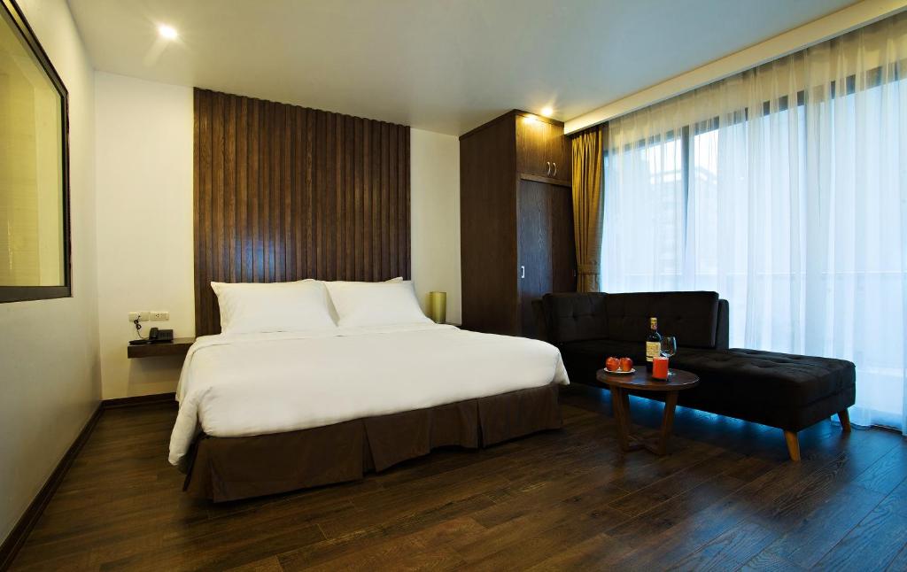 Postel nebo postele na pokoji v ubytování Inearth Hotel