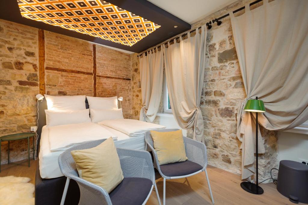 Posteľ alebo postele v izbe v ubytovaní Luxury Rooms Bajamonti
