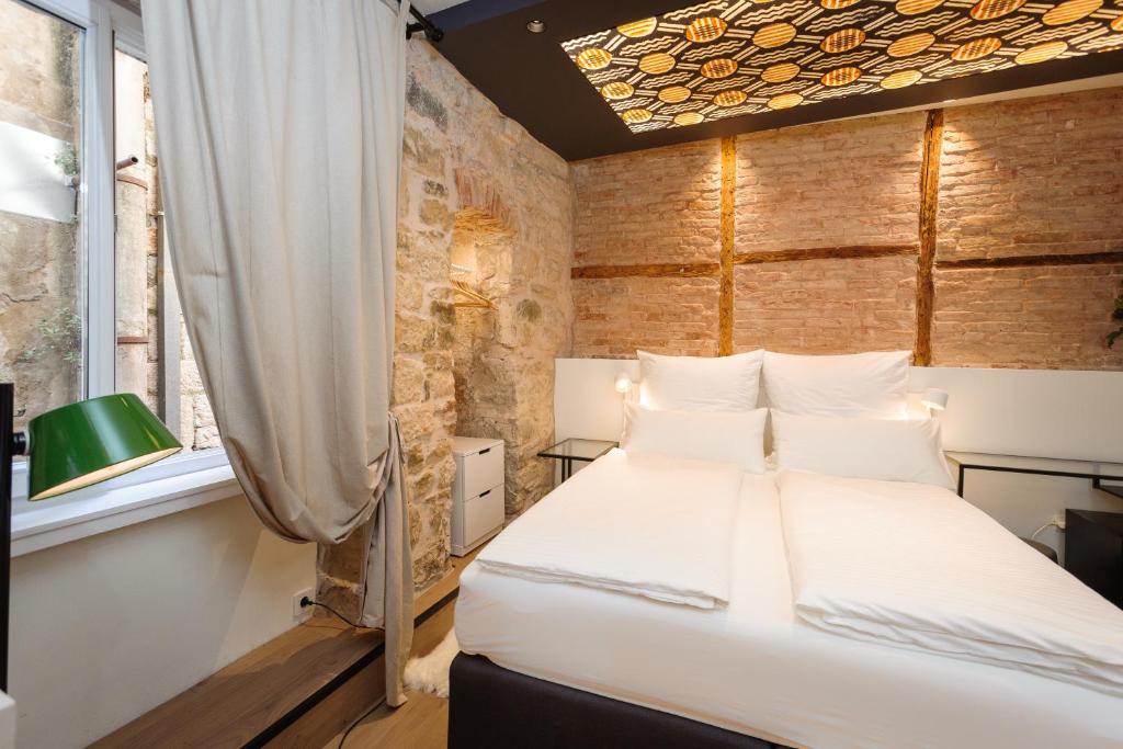 Posteľ alebo postele v izbe v ubytovaní Luxury Rooms Bajamonti