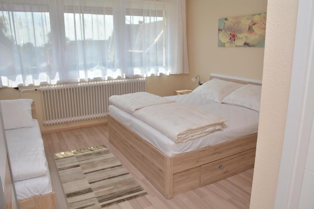 Postel nebo postele na pokoji v ubytování Molnár Vendégház