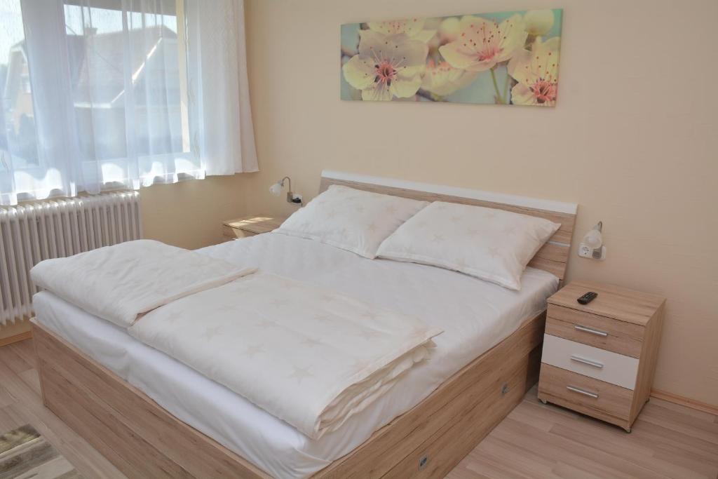 Postel nebo postele na pokoji v ubytování Molnár Vendégház
