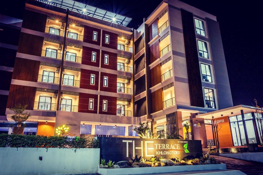 a large building with a sign in front of it at The Terrace Khlongtoei in Hat Yai