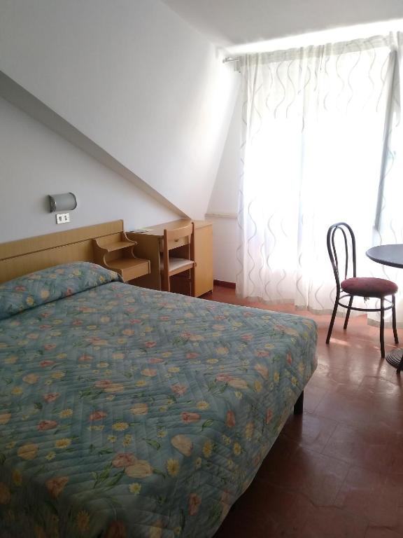 Postel nebo postele na pokoji v ubytování Hotel Atis