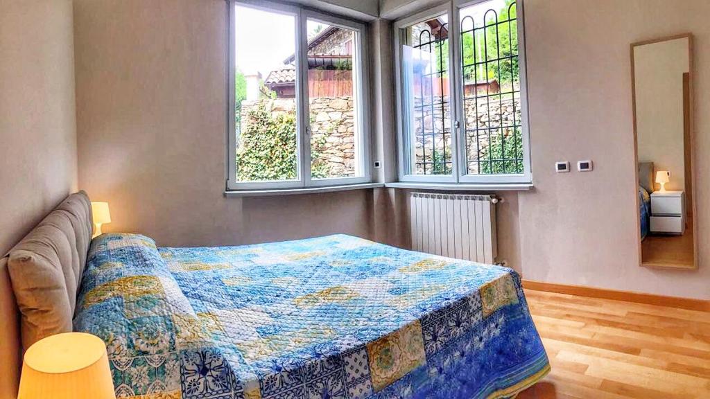Postel nebo postele na pokoji v ubytování Oleandro 2 apartment in Villa Cerutti