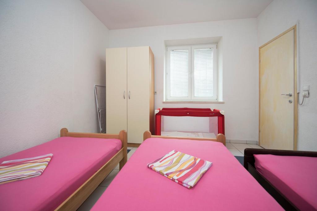 Posteľ alebo postele v izbe v ubytovaní Apartment Dragica
