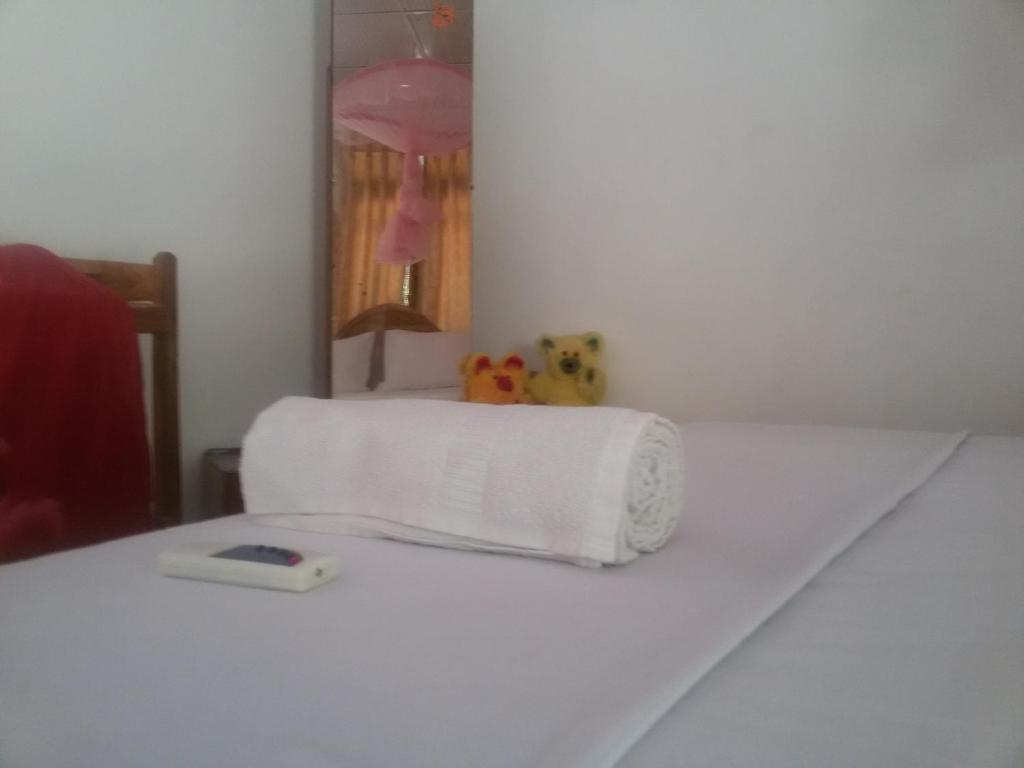 Postel nebo postele na pokoji v ubytování Sigiri Binara Villa