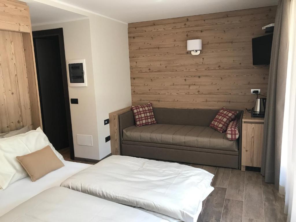 Postel nebo postele na pokoji v ubytování Hotel Le Cime