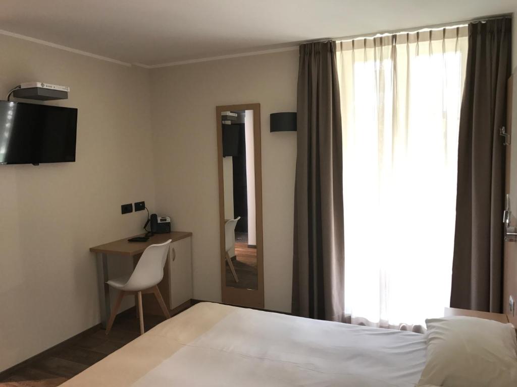 TV a/nebo společenská místnost v ubytování Hotel Le Cime