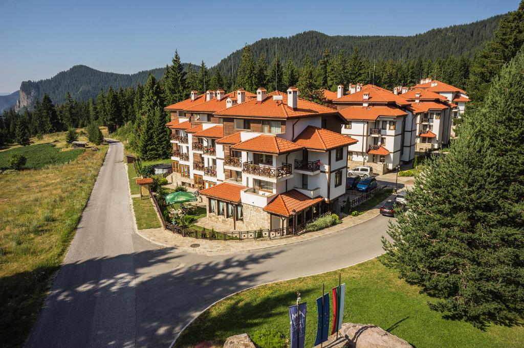 an aerial view of a large building with orange roofs at Mountain Lake Hotel in Smolyan