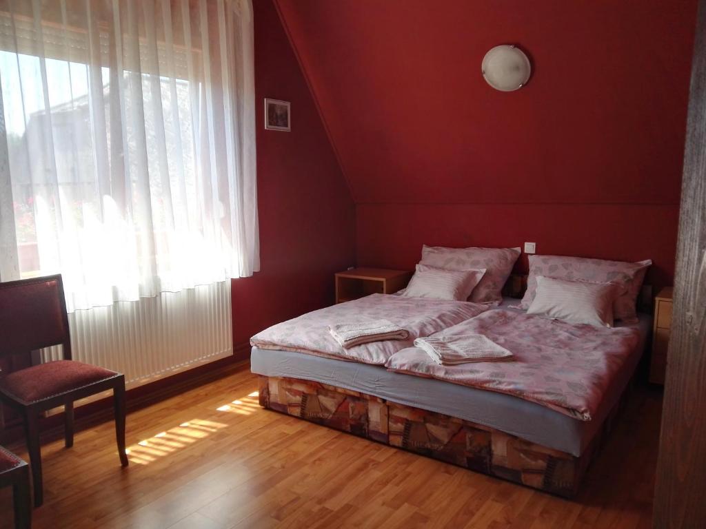 Postel nebo postele na pokoji v ubytování Agávé Apartman
