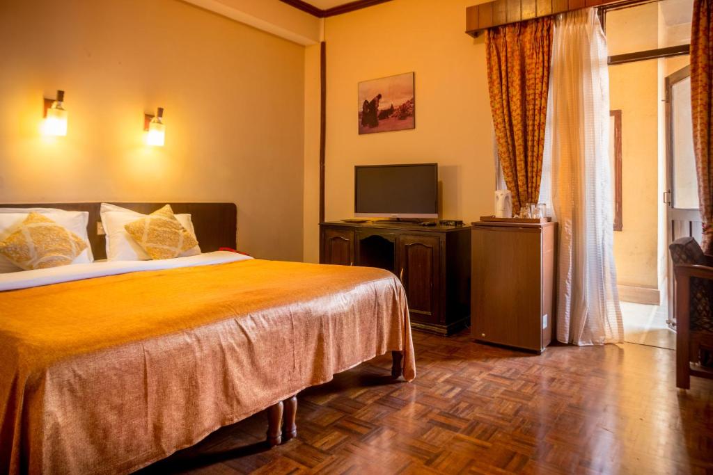 Postel nebo postele na pokoji v ubytování Hotel Excelsior