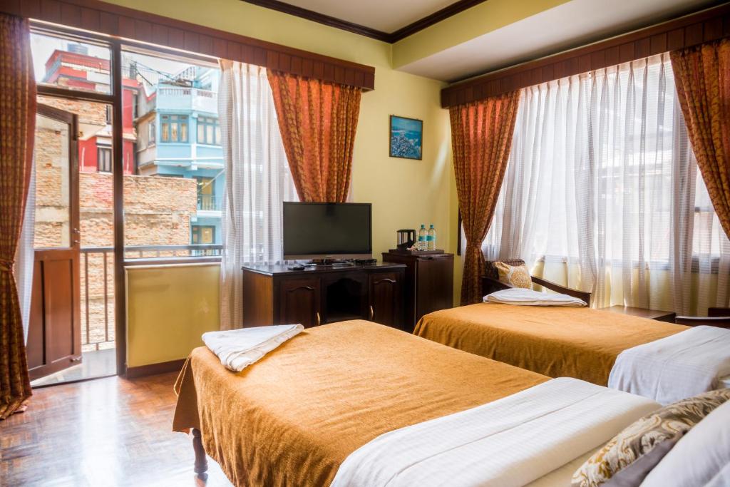 Postel nebo postele na pokoji v ubytování Hotel Excelsior
