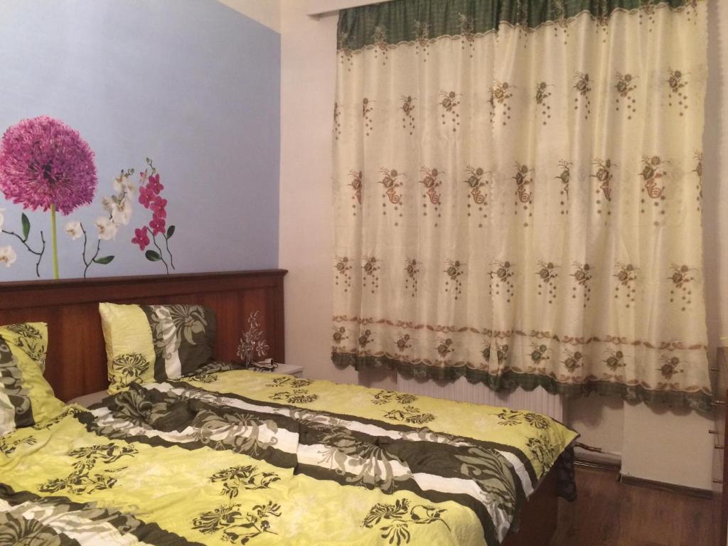 Postel nebo postele na pokoji v ubytování Blue Rose Apartman