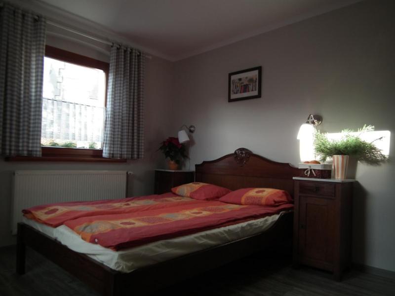 Posteľ alebo postele v izbe v ubytovaní Apartamenty Na Wzgórzu