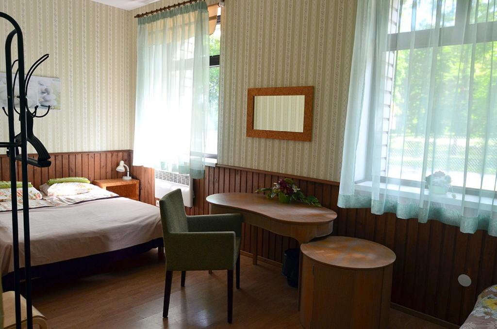 Postel nebo postele na pokoji v ubytování Vinni Hostel