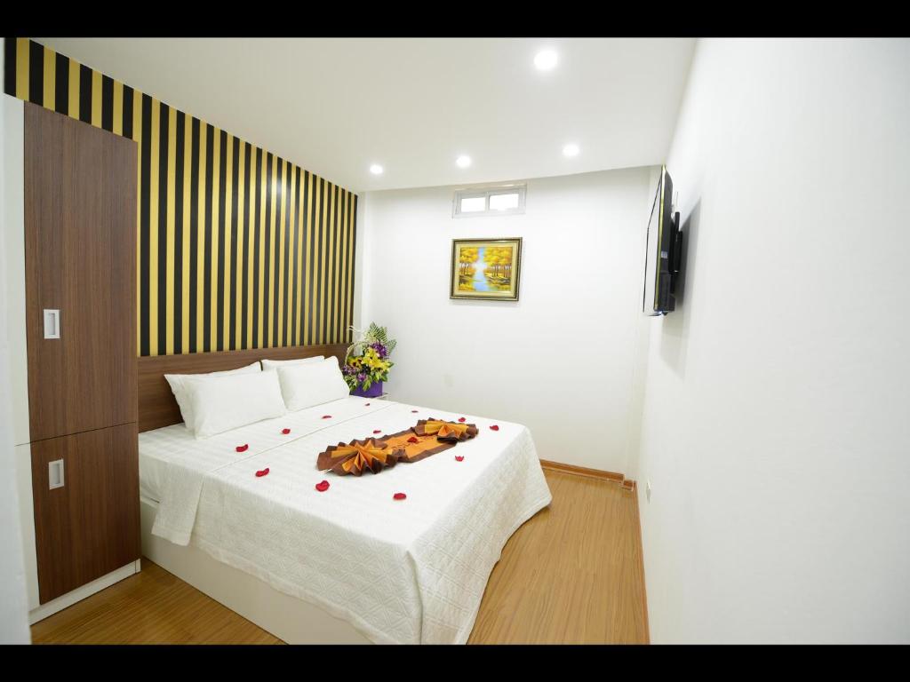 Postel nebo postele na pokoji v ubytování Hanoi Golden Hostel