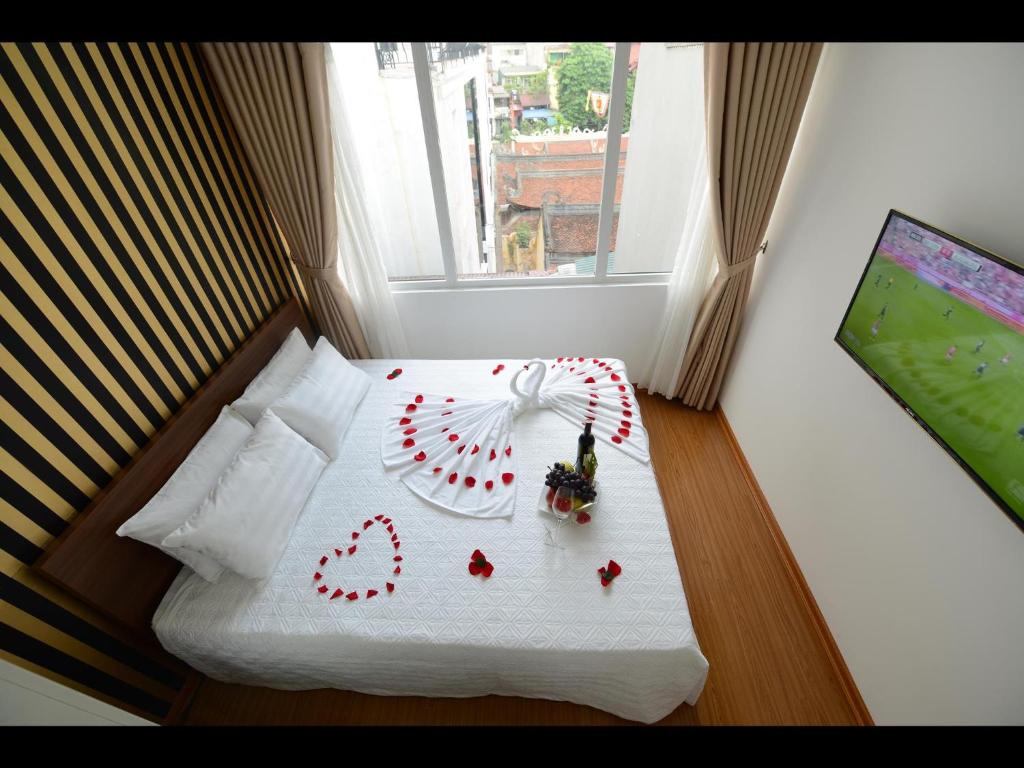 Postel nebo postele na pokoji v ubytování Hanoi Golden Hostel