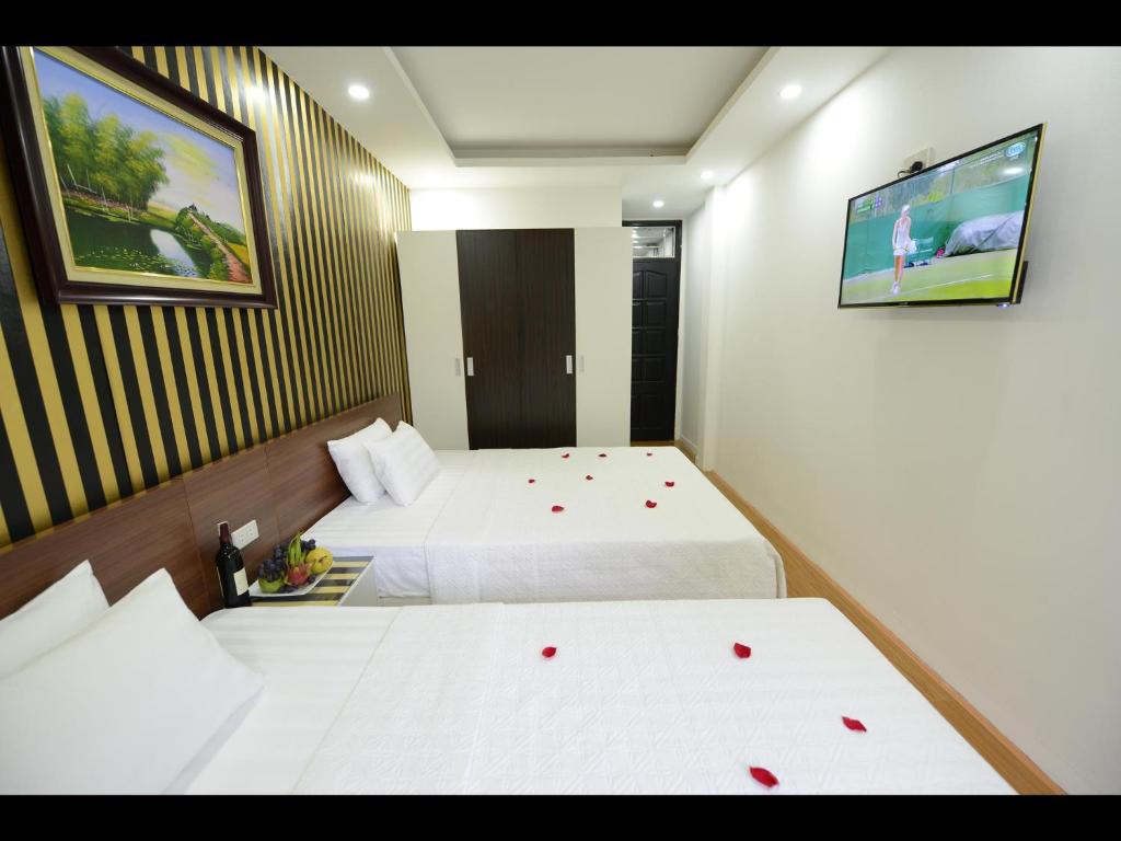 Postel nebo postele na pokoji v ubytování Hanoi Golden Hostel