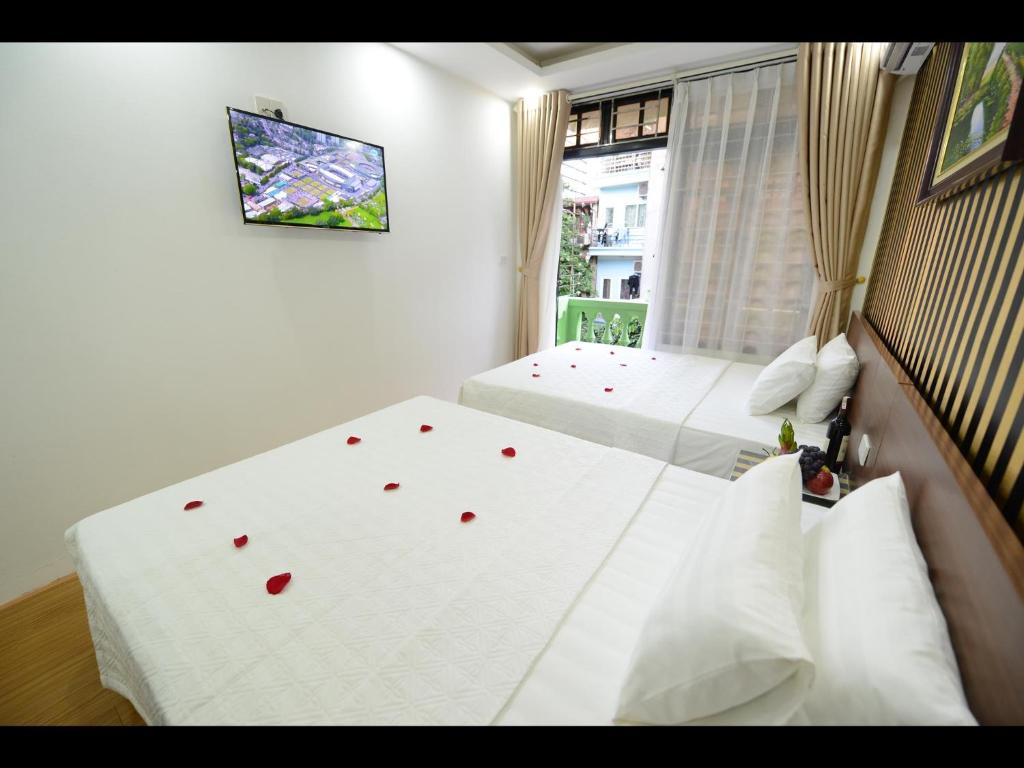 Postel nebo postele na pokoji v ubytování Hanoi Golden Hostel
